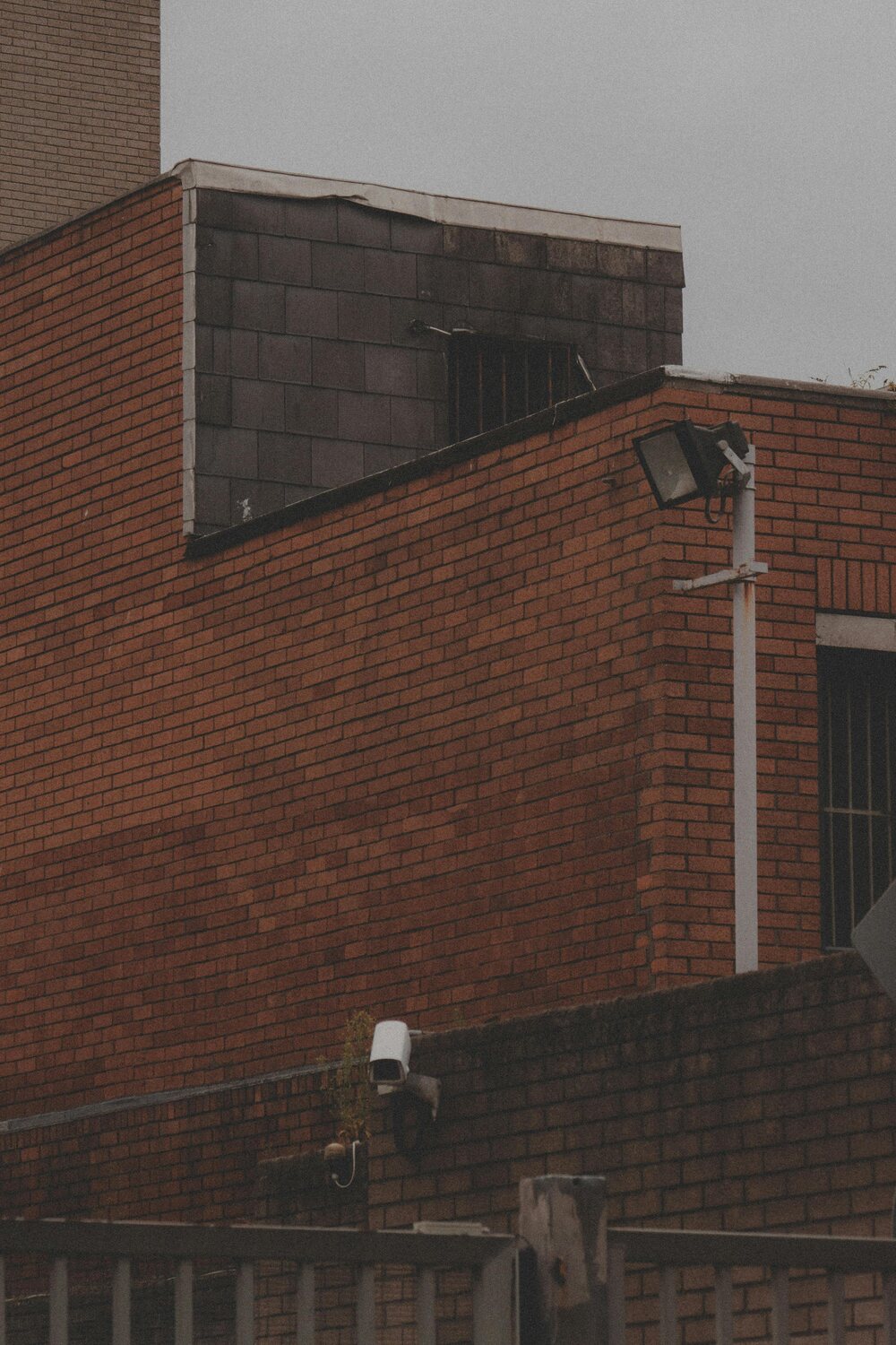 Security cameras mounted on a brick building